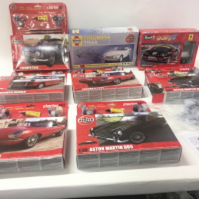 A collection of 7Airfix model car kits includes 6 starter kits with paints also includes 1 Revell kit.