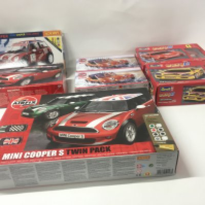 A collection of 7 model car kits by Airfix ..Hornby and Revell