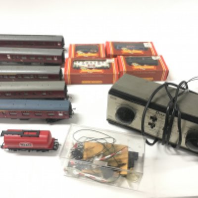 A collection of model railway coaches and accessories including buildings. 00 gauge