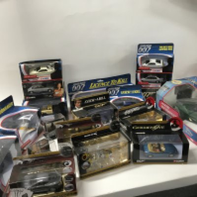 A collection in excess of 15 boxed 007 James Bond themed cars.