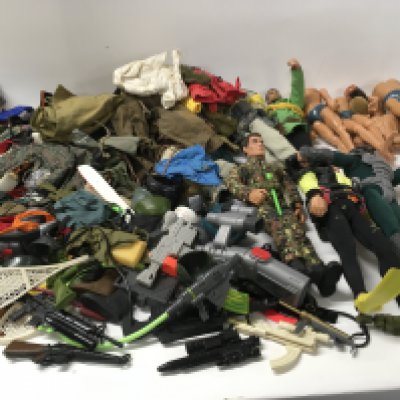 A large collection of Vintage Action Man figure parts and accessories including clothing and weapons etc.