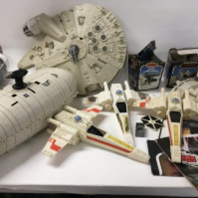 A collection of Vintage Star Wars ships and mini rigs. Also includes leaflet and comic.