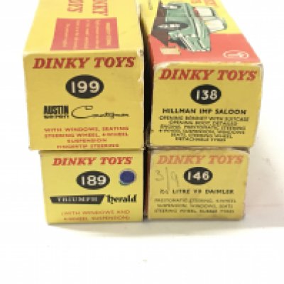 A collection of 4 boxed diecast cars by Dinky includes..No138 a Hillman Imp Saloon..No146 a V8 Daimler..No189 a Triumph Herald and No199 a Austin Seven Countryman.