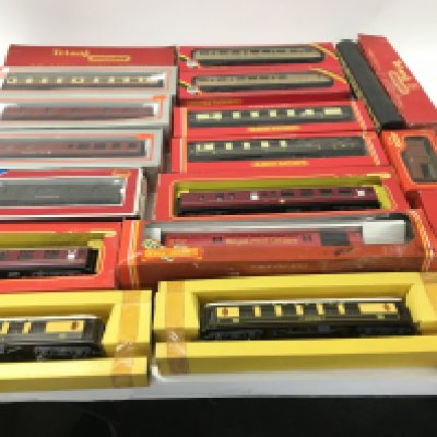 A collection of 17 boxed and 1 loose Coaches and cars 00 gauge. Manufacturers include Hornby..Lima. No reserve