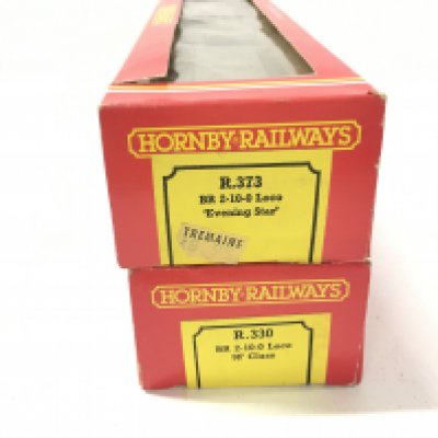 2x boxed 00 gauge model locomotives by Hornby. Includes R.330. BR 2.10.0 9F Class and R.373. BR 2.10.0. Evening Star. No reserve