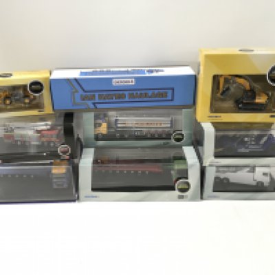 A collection of of 9 boxed diecast commercial and construction vehicles. 1:76 scale. No reserve