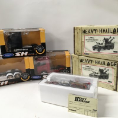 A group of 5 boxed diecast model commercial vehicles including 2x Corgi scale 1:50 Heavy Haulage Scammel Contractor Wrecker in Eddie Stobart livery. Plus 3x Welly scale 1:32 Artic Crew cabs ..2 are Scania and 1 Volvo. No reserve
