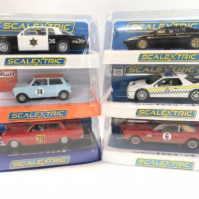 6 X Boxed Scalextric Cars. A Chevrolet Monte Carlo. A Austin Mini. A Ford Cortina GT. A Lotus Esprit S2. A Ford RS200 And A Ford Mustang.