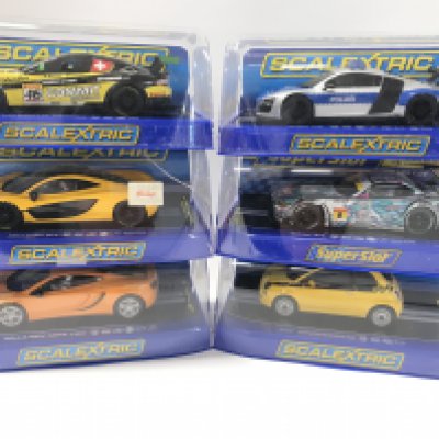 6 Boxed Scalextric Cars. A Maserati Trofeo. A Audi R8. A McLaren P1. A BMW z4. A McLaren MP4-12C And A Fiat Cinquecento.
