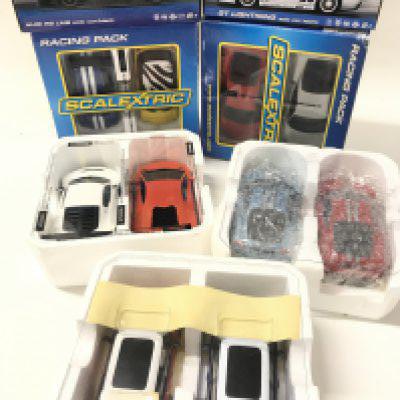 2 X Scalextric Racing Packs. A Boxed Audi R8 LMS. A GT Lightning and other Cars.