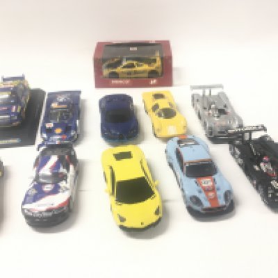 A collection of 10 Scalextric cars and 1 boxed Ninco car.