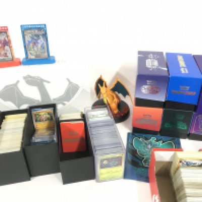 A Box Containing a Collection of Various Pokemon Cards. Viewing Is Recommended. Including Sword And Sheild. Dragon Majesry. Twilight Masquerade. Etc.