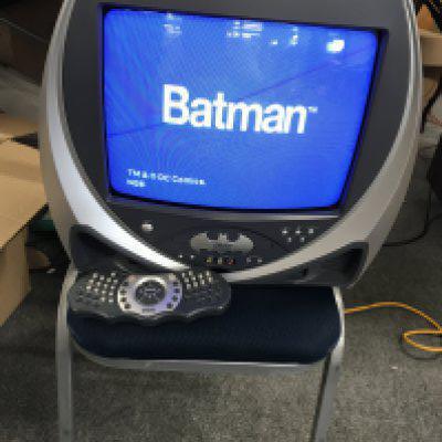 A boxed vintage Batman D.C. comics TV. With built in DVD player. Seen working. Including original owners manual and Batarang shaped remote control. No reserve.