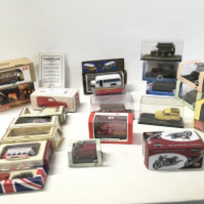 A collection in excess of 20 boxed diecast vehicles featuring buses..vans..cars..etc. manufacturers include Atlas..Corgi.etc. Includes boxed tinplate bus by Jaya. No reserve