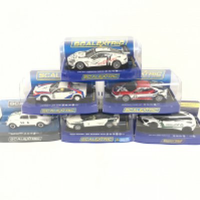 6 boxed Scalextric cars, to include Aston Martin DBR9.Ferrari 308. Ferrari F430. Volkswagen Beetle. Alfa Romeo 159. McLaren 720s Police car. No reserve.