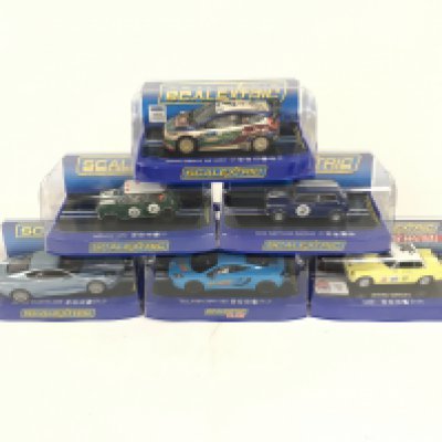 6 boxed Scalextric cars. To include limited edition MGB. McLaren MP4. Aston Martin DBS. Morris Mini. Mini Neptune. Ford Fiesta R/S. No reserve.