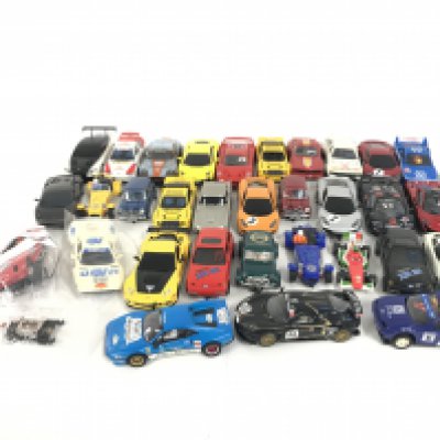 A box containing approximately 30 Scalextric cars. Plus some extra parts. No reserve.