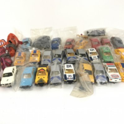 A bag containing a collection of Scalextric cars. Also included some spare parts. No reserve.