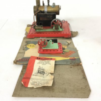 A Mamod model static live steam engine with A Minature machines tool steam hammer.No reserve with original box in poor condition.