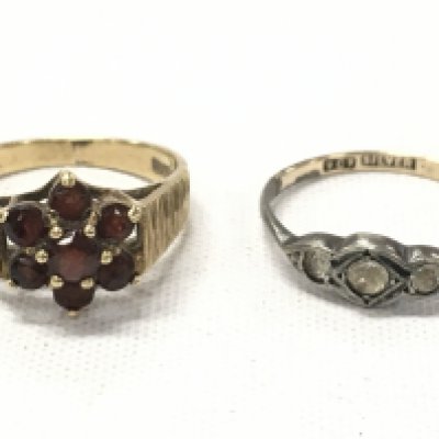 A 9ct gold ruby set ring (2.6g total weight) and a silver ring. Postage category A