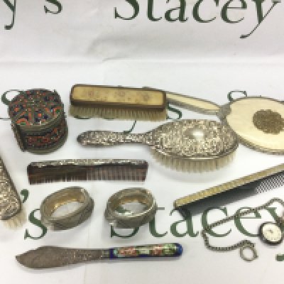 A silver backed dressing table set and one other plus a silver and enamel knife, fob watch etc. Shipping category D.