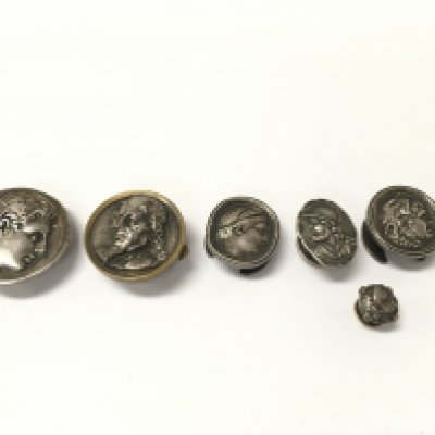 Collection of antique buttonhole and silver studs including a 19th century stud depicting a classical male figure. Postage B