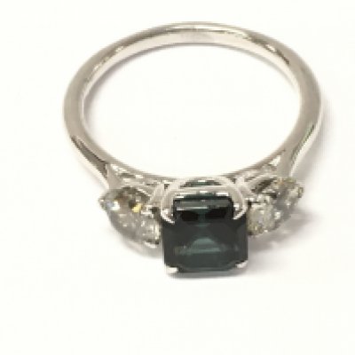 A platinum 3 stone ring set with step cut parti tourmaline flanked diamonds. Tourmaline 1.65ct and diamonds 1.05ct. Size N