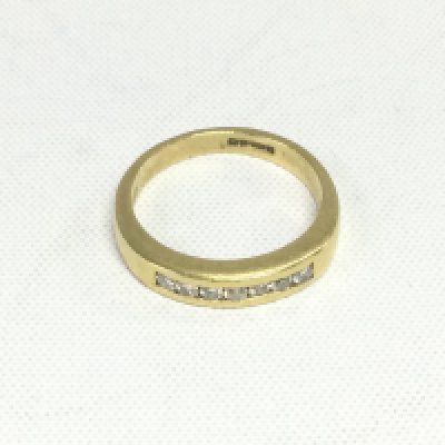 An 18ct gold diamond half hoop ring, approx 4.3g and approx size L. Shipping category A.