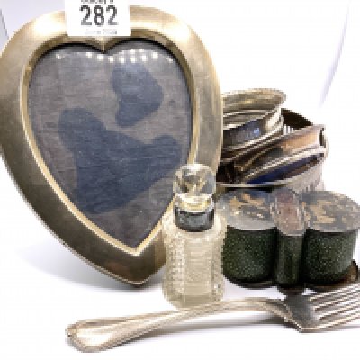 A mixed lot of hallmarked silver articles including a silver wine bottle coaster. (B)