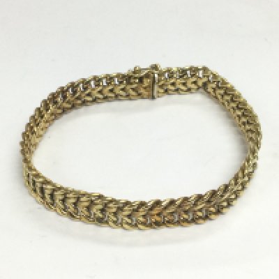 A 14k gold bangle, approx 12.7g. Shipping category A.