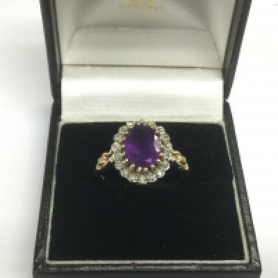 A 9ct gold ring set with a central amethyst, approx 4.2g and approx size Q. Shipping category A.