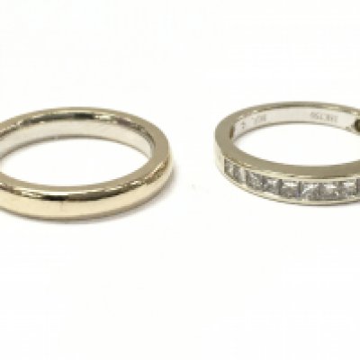 An 18ct diamond half eternity ring & an 18ct wedding band, 7.3g total weight. Postage category A