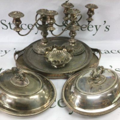 A collection of silver plated items comprising a tray, candelabra etc. Shipping category D.