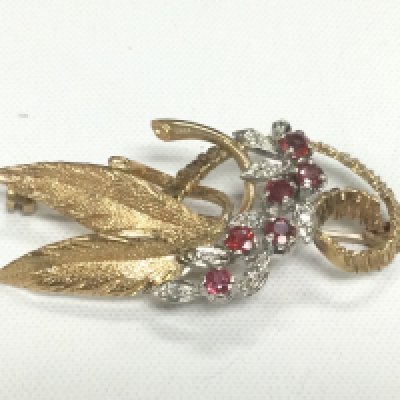 A 9ct gold ruby and diamond floral brooch, approx 7g. Shipping category A.