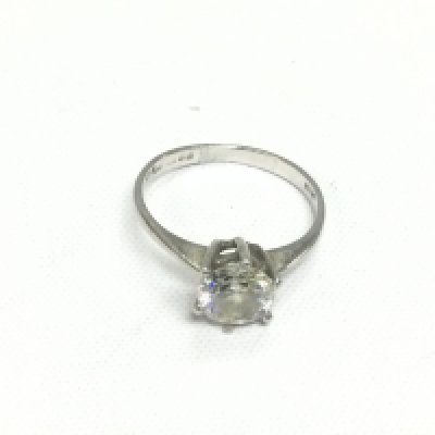 A platinum and moissanite solitaire ring, approx size M. Shipping category A.