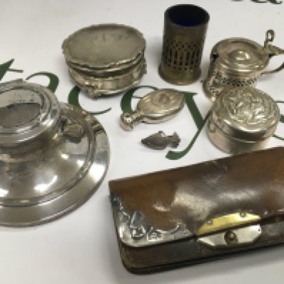 An assortment of silver items including condiments and other items.
