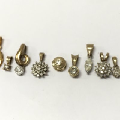 9ct gold and diamond stone set pendants , 6.2g total weight. Postage category A