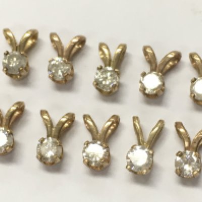 9ct Gold and diamond set pendants, 1.6g total weight. Postage category A