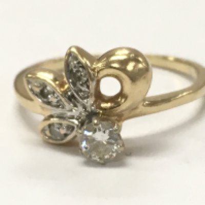 A 14ct gold diamond cluster ring , 2.9g total weight . Size N. Postage category A