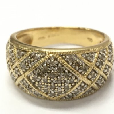 An 18ct gold cluster band ring, 6.2g total weight. Postage category A