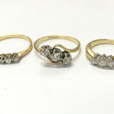 18ct gold three stone diamond rings , 7.7g total weight. Postage category A