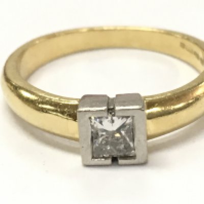 An 18ct gold princess cut diamond solitaire ring, 3.7g size L. Postage category A