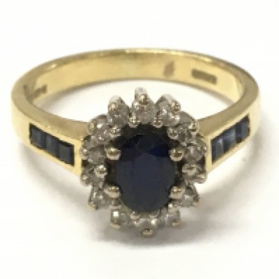An 18ct gold sapphire and diamond cluster ring, size K/L. 4.2g postage category A