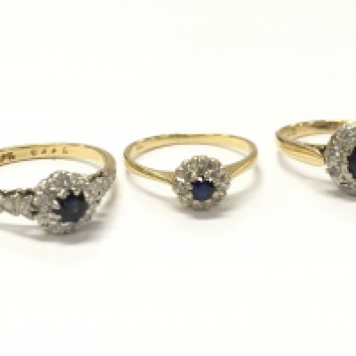 Three 18ct gold sapphire and diamond cluster rings, size J, K, N/O. 7.1g total weight