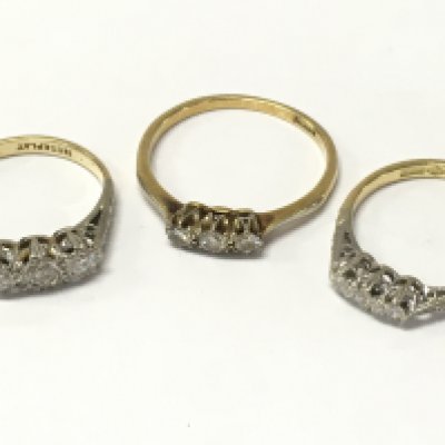 18ct gold and platinum three stone diamond rings . 7g total weight Postage category A