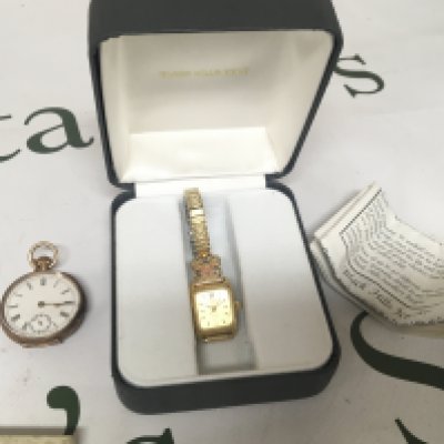 A 14carat gold cased ladies button wind watch for restoration and a Black Hills Jewellery ladies watch with box and paperwork. (2)