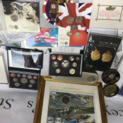 Two boxes containing Royal mint coins commemorative and uncirculated including nine Annual coin Sets London 50p and loose coinage various.