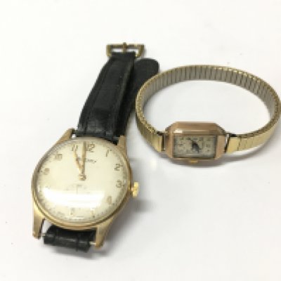 Two gold cased watches.