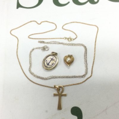 A small collection of pendants and chains including some gold examples. Shipping category A.