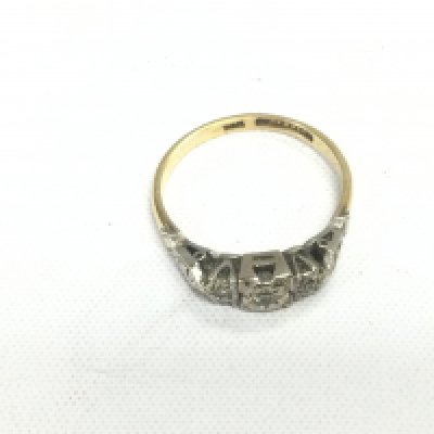 An 18ct gold and platinum ring set with small diamonds, approx 2.9g and approx size O. Shipping category A.